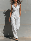FJØRNA cotton blend sleeveless jumpsuit for women with V-neck, tailored fit, single-breasted design, and pant style.