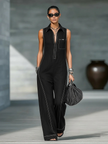 Loose-fit sleeveless jumpsuit for women by FJØRNA with contrast trim and wide-leg pants, shown in a stylish, casual fit.