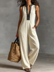 FJØRNA linen blend sleeveless jumpsuit for women with stand collar and embroidery detail, featuring pants style and casual elegance.