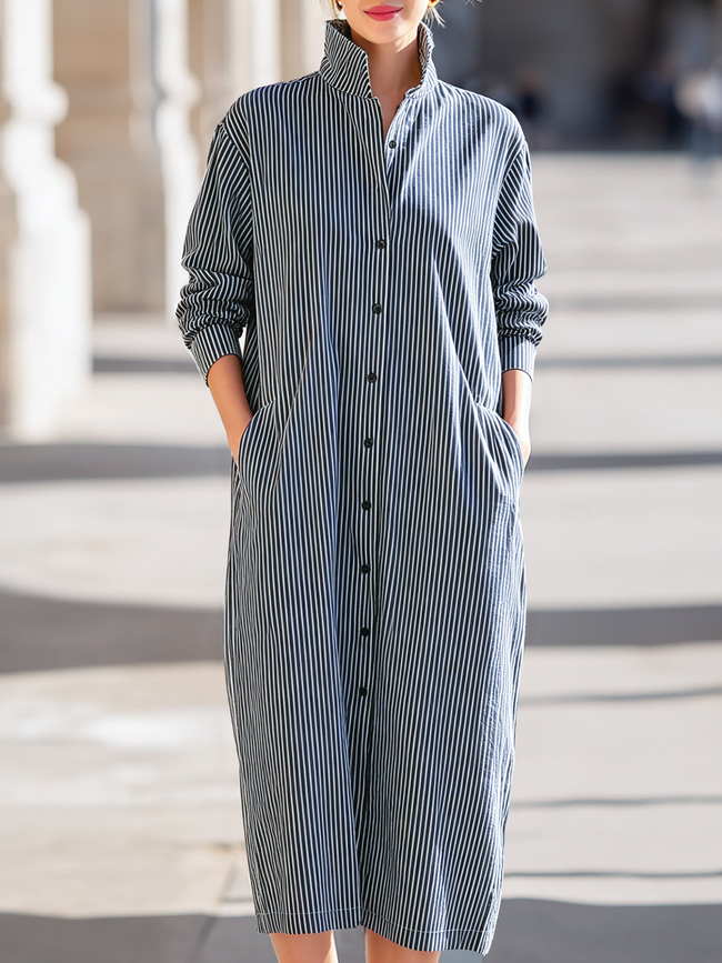 FJØRNA midi dress for women featuring a flowy silhouette, sleeveless design, and elegant fabric, suitable for casual or formal wear.