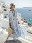 Loose summer long kaftan dress for women by FJØRNA, featuring flowing fabric and a relaxed fit, perfect for warm weather.