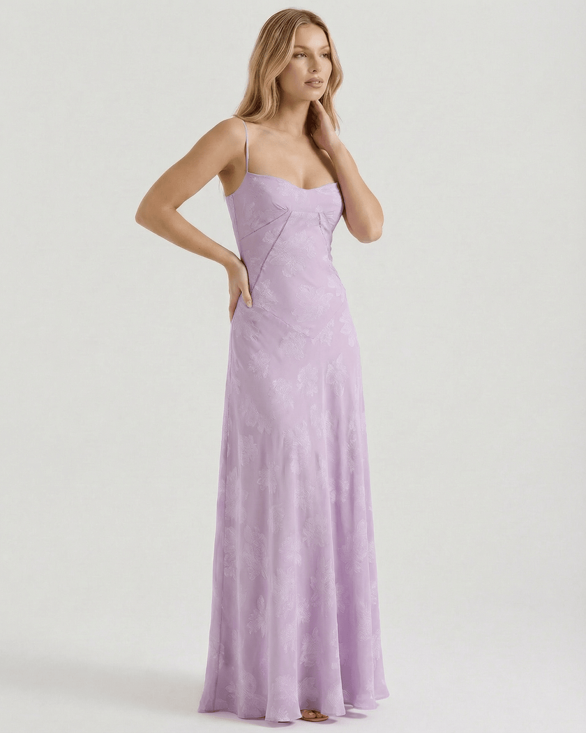 Elegant lavender lace maxi dress for women with floral print, sheer fabric, and a lace-up back by FJØRNA.