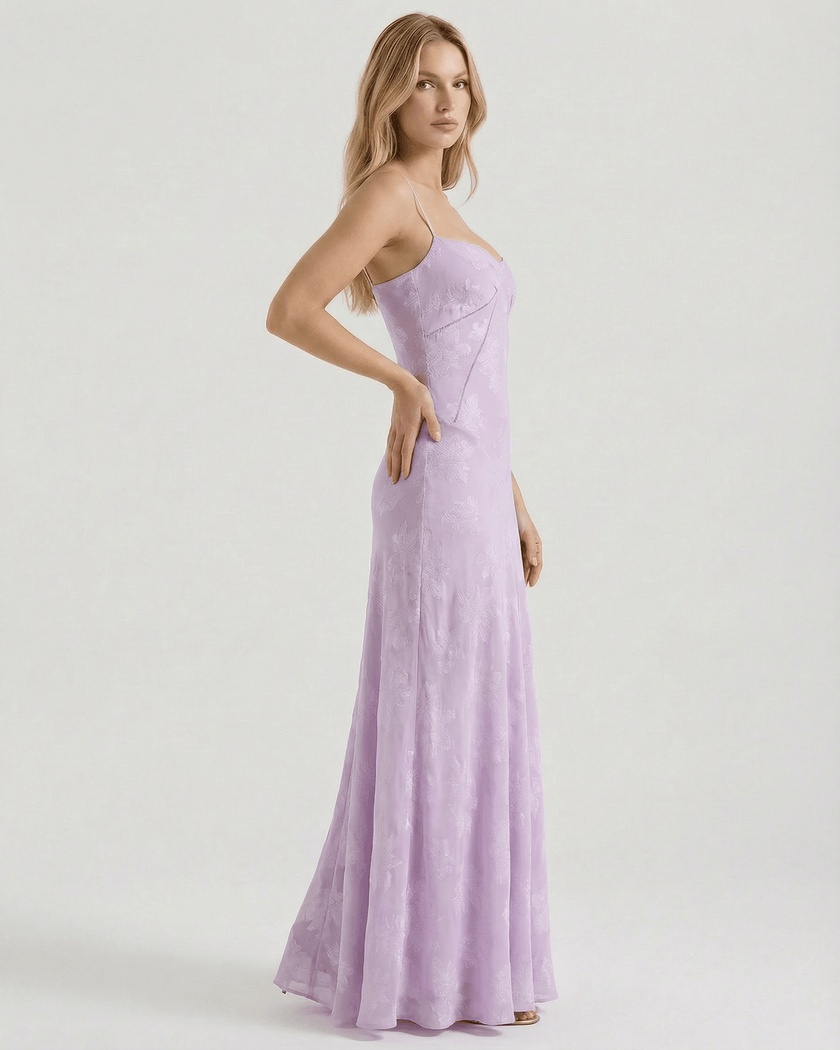 Lavender lace maxi dress for women by FJØRNA featuring floral print, sheer fabric, and lace-up back for elegant style.
