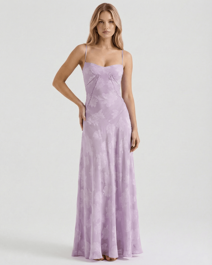 Lavender lace maxi dress for women by FJØRNA featuring floral print, sheer fabric, and a lace-up back for elegant style.
