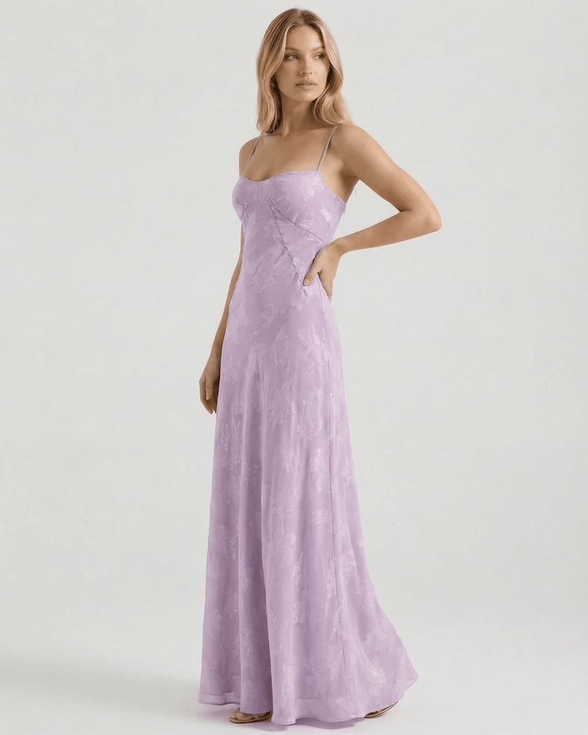 Lavender floral lace maxi dress for women by FJØRNA, featuring sheer fabric and a flowing, elegant design.