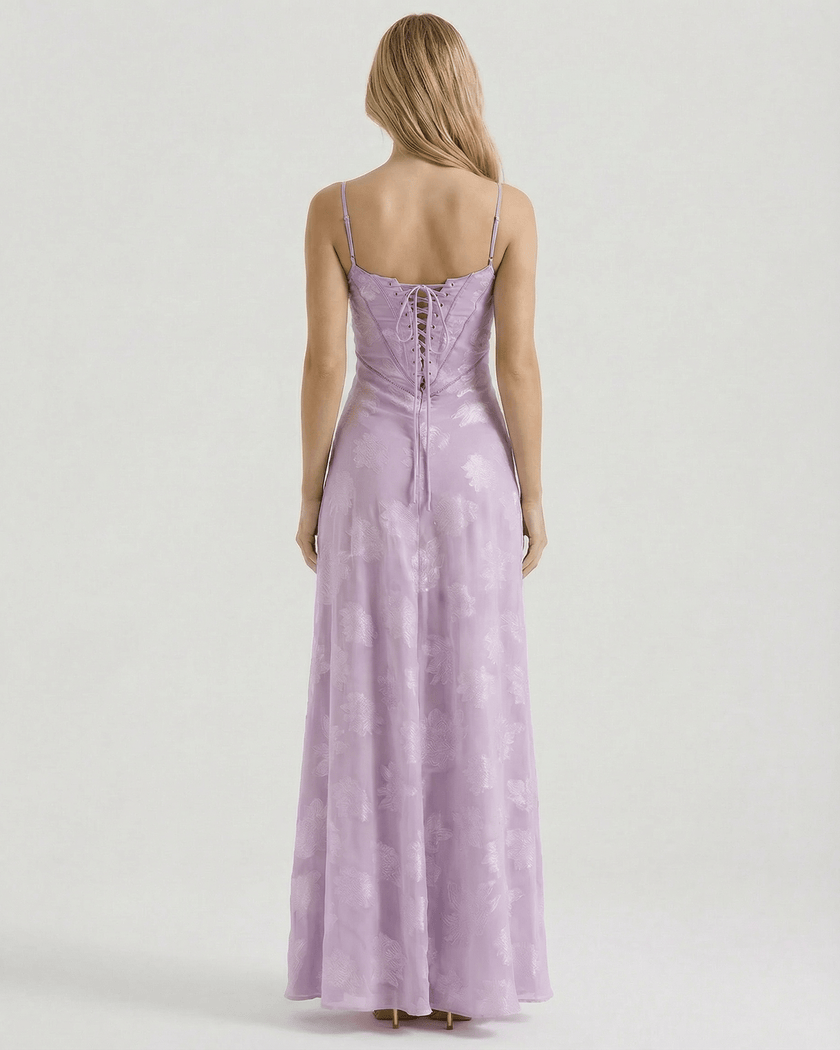 Lavender floral lace maxi dress for women by FJØRNA, featuring sheer fabric and a lace-up back design.