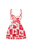 FJØRNA Leila printed cut-out mini dress in red, featuring a stylish design and short length, perfect for warm weather.