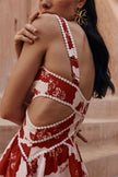 FJØRNA Leila printed cut-out mini dress in red with floral print and stylish cut-outs, perfect for trendy summer occasions.
