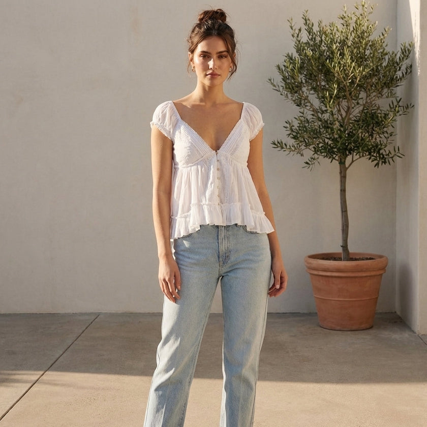 FJØRNA women's summer blouse with V-neck and short sleeves, featuring a casual, flowy fit perfect for warm weather.