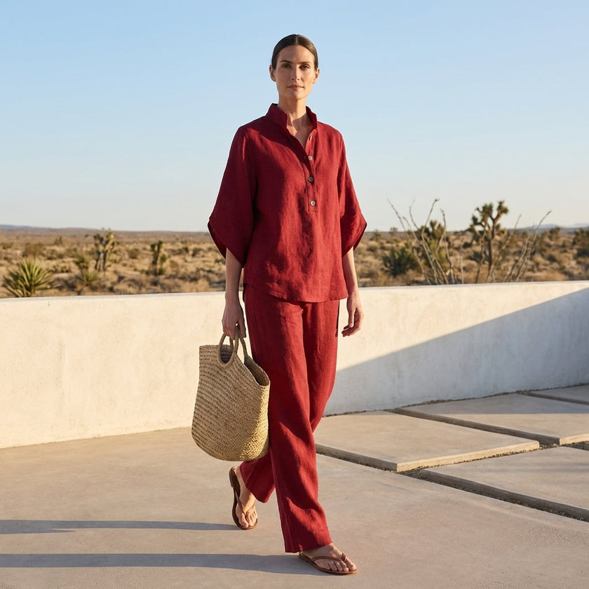FJØRNA woven two-piece relaxed shirt and wide-leg trouser set for urban leisure, styled casually outdoors.