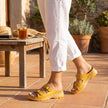 FJØRNA orthopedic buckle platform slide sandals for women, featuring adjustable straps and chunky soles, worn casually outdoors.
