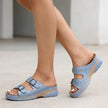 Light blue FJØRNA orthopedic buckle platform slide sandals for women, featuring a comfortable slip-on design with adjustable straps.