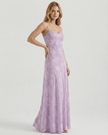 Lavender floral lace maxi dress for women by FJØRNA, sheer fabric with lace-up back and elegant flowing design.