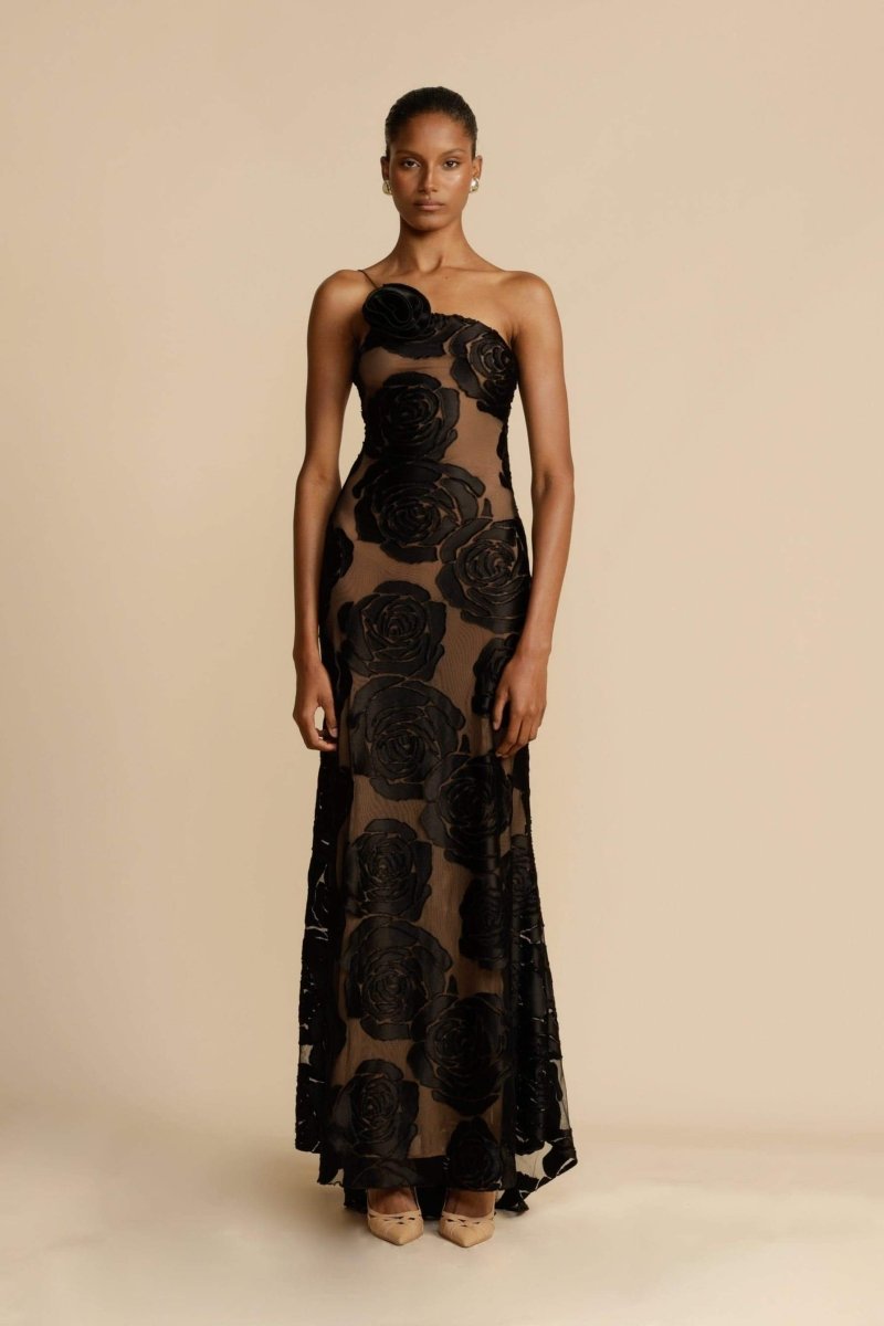 FJØRNA Lindsay floral printed one-shoulder maxi dress in black with vibrant floral pattern, flowing skirt, and elegant design.