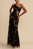 FJØRNA Lindsay floral printed one-shoulder maxi dress in black with vibrant floral pattern, flowing fabric, and elegant design.