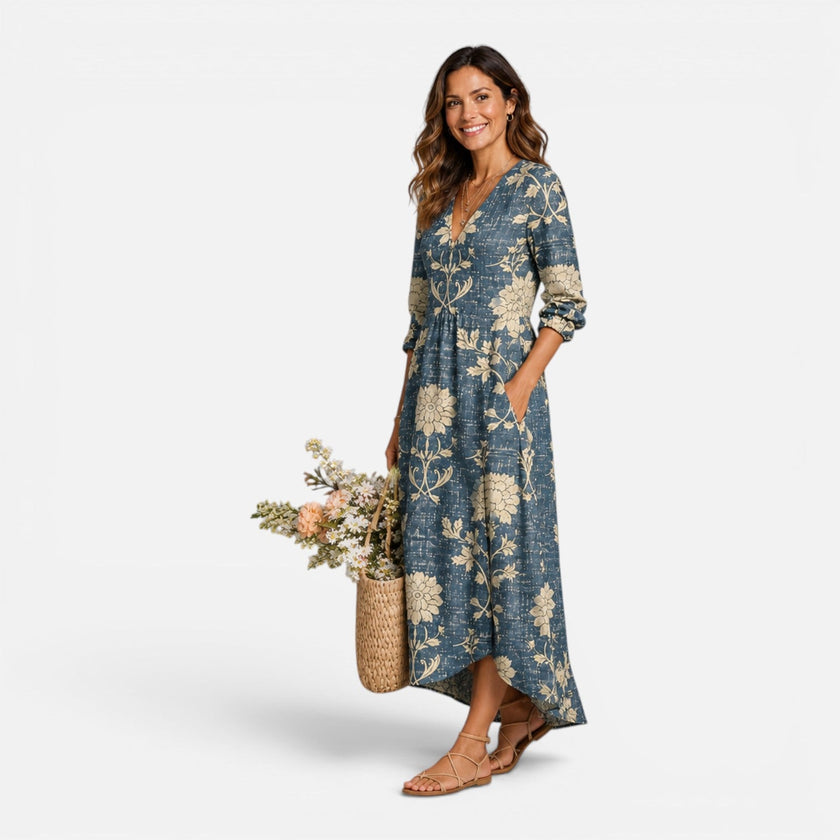 Women's playful floral maxi dress by FJØRNA, featuring lightweight linen fabric and vibrant floral pattern for summer wear.