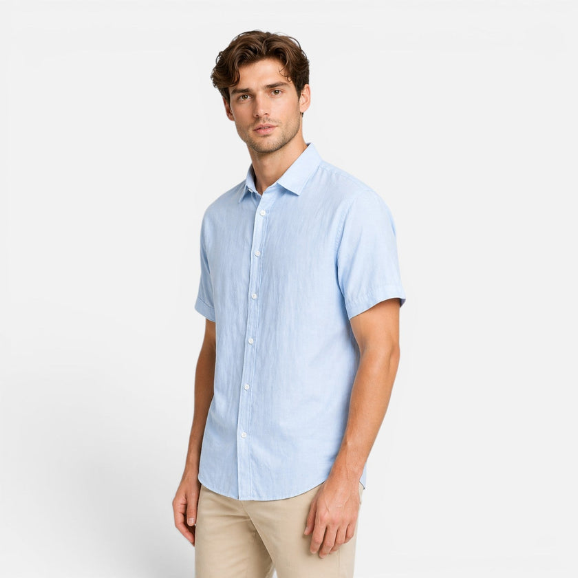 Men's FJØRNA linen shirt with short sleeves and button-up front, made from breathable cotton blend fabric.