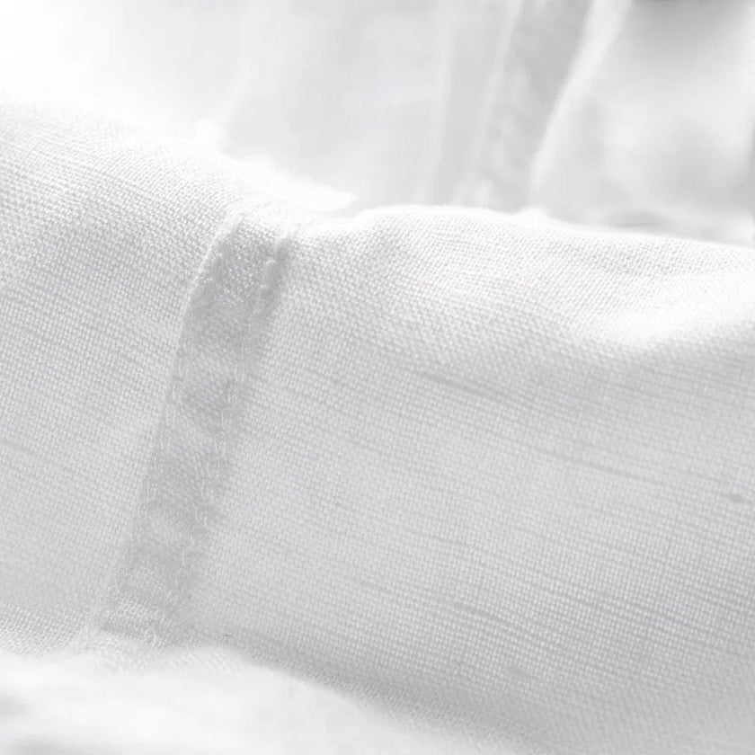 Men's FJØRNA linen shirt with short sleeves, breathable cotton blend fabric, and button-up front for comfortable summer wear.