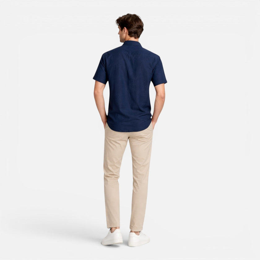 Men's FJØRNA linen shirt with short sleeves, breathable cotton blend fabric, button-up design, ideal for warm weather.