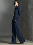FJØRNA women's sparkling knit jumpsuit with zip front, long sleeves, and wide-leg pants, showcasing a stylish and comfortable design.