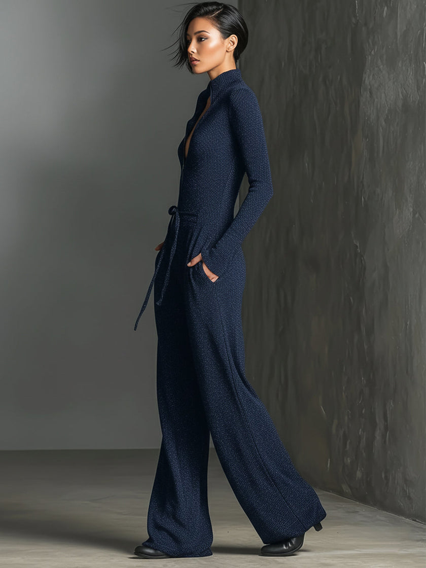 FJØRNA women's sparkling knit jumpsuit with zip front, long sleeves, and wide-leg pants, showcasing a stylish and comfortable design.