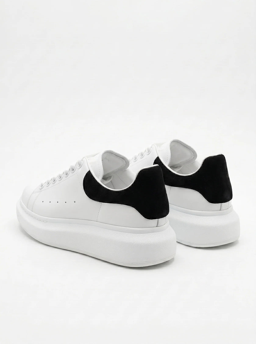FJØRNA men's white lace-up trainers with minimalist design, back view showing sleek style and comfortable sole for everyday wear.
