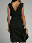 FJØRNA Amelie White Dress with deep V-back, side slit, elegant evening gown for special occasions.