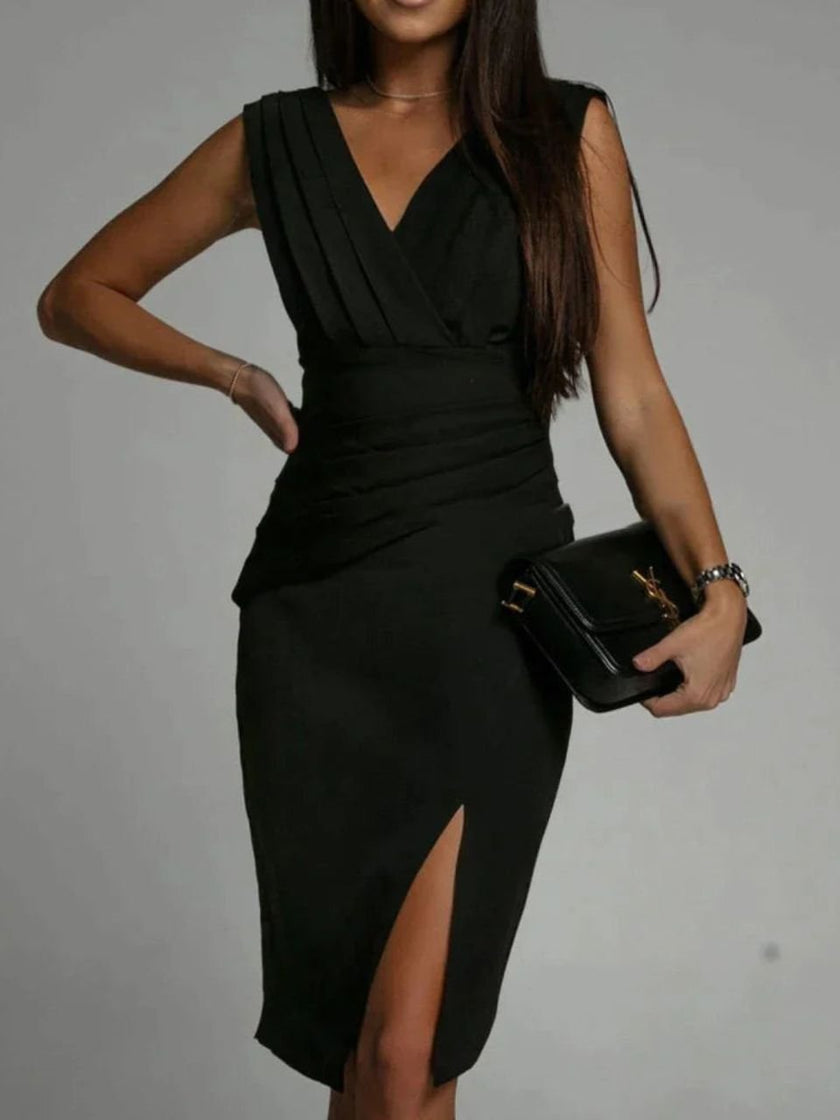Elegant white FJØRNA Amelie night dress with a deep V-back and side slit, perfect for evening occasions.