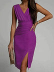 Elegant FJØRNA Amelie White Dress with side slit and deep V-back, perfect for evening occasions.