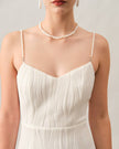 Red FJØRNA midi dress for women with pearl straps and textured fabric, featuring a stylish, elegant design.