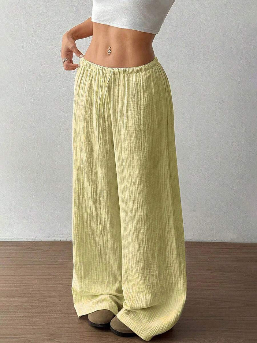 FJØRNA Mirabelle women's wide-leg casual pants with drawstring waist, relaxed fit, in soft fabric, perfect for everyday wear.