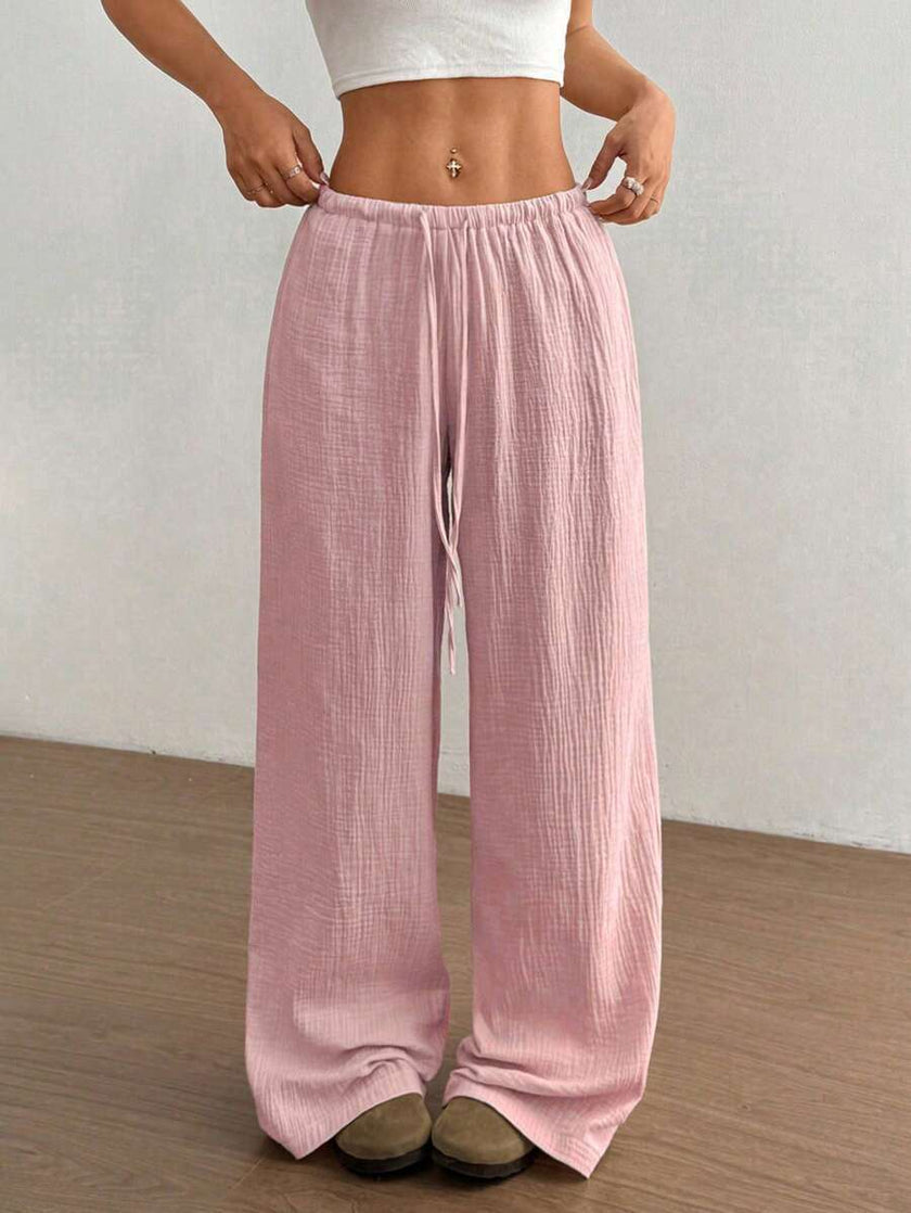 FJØRNA Mirabelle women's wide-leg casual pants with drawstring waist, lightweight fabric, relaxed fit, and neutral color.