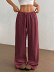 FJØRNA Mirabelle women's wide-leg casual pants with drawstring waist, lightweight fabric, and relaxed fit in neutral color.