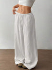 FJØRNA Mirabelle women's wide-leg drawstring casual pants, beige fabric, relaxed fit, front pockets, and adjustable waist.