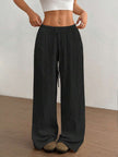 FJØRNA Mirabelle women's wide-leg drawstring casual pants displayed on a model, showing relaxed fit and comfortable style.