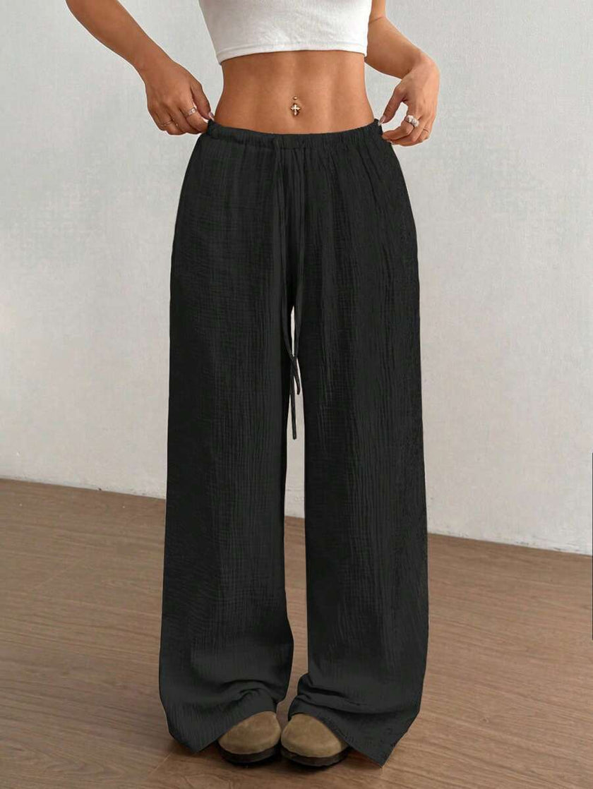 FJØRNA Mirabelle women's wide-leg drawstring casual pants displayed on a model, showing relaxed fit and comfortable style.