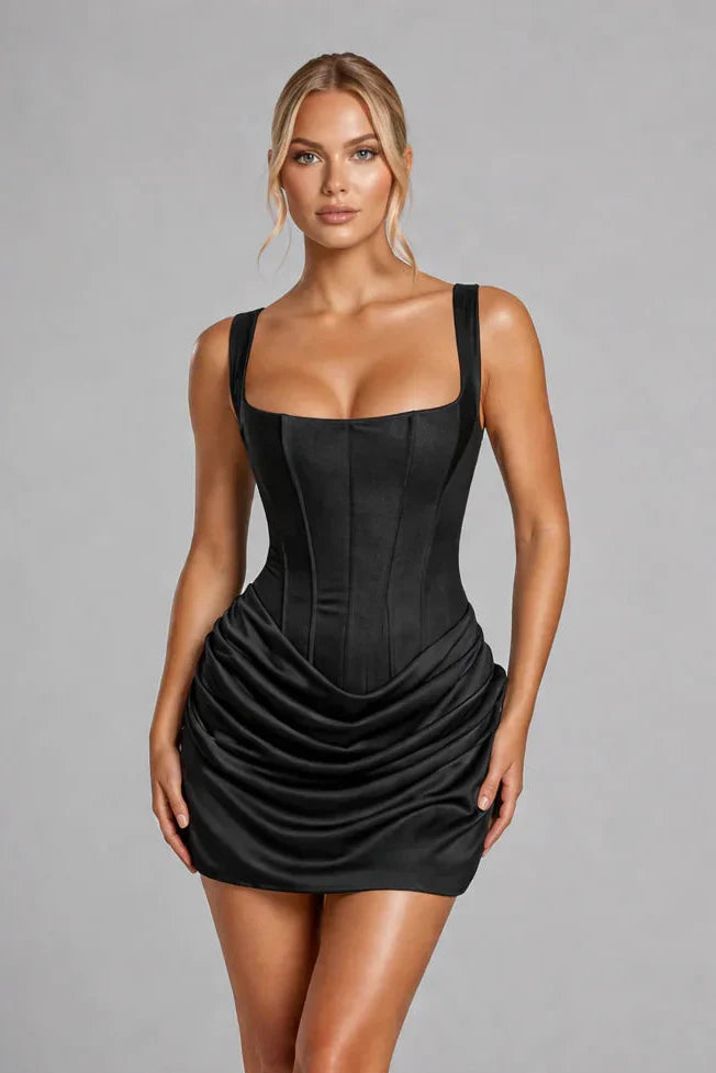 FJØRNA women's square neck ruched mini dress on model, featuring a fitted silhouette and stylish design.