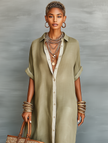 Full-body image of a woman wearing a FJØRNA linen maxi dress, showcasing a stylish, flowy summer dress for women.