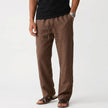 Men's FJØRNA breathable linen trousers with a relaxed fit, showing lightweight fabric and casual waistband on a neutral background.