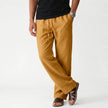 Men's breathable linen trousers by FJØRNA, showcasing lightweight, comfortable fabric with a relaxed fit and stylish design.