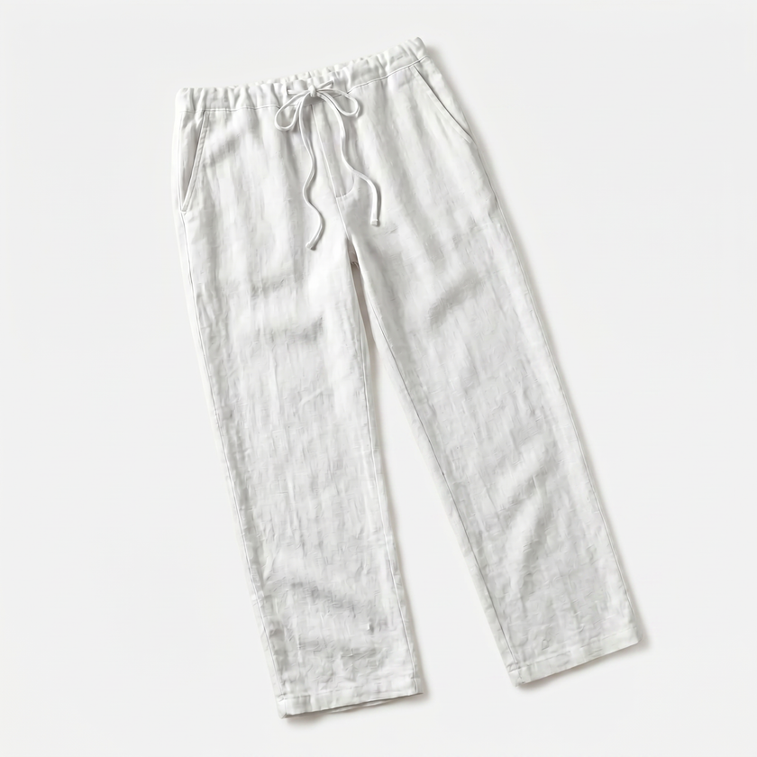 Men's breathable linen trousers by FJØRNA, showcasing lightweight, comfortable fabric and relaxed fit for casual wear.