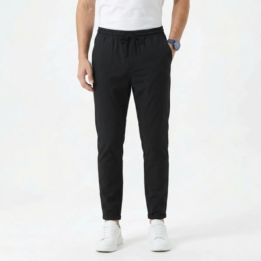 Men's stretchable comfort trousers by FJØRNA, showing a pair of men's pants with a relaxed fit and elastic waistband.
