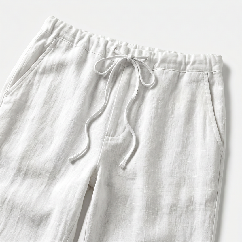Men's FJØRNA breathable linen trousers with a relaxed fit, featuring a light, natural fabric and stylish design.