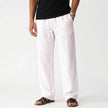 Men's breathable linen trousers by FJØRNA, featuring a relaxed fit and natural fabric texture, ideal for casual and warm-weather wear.