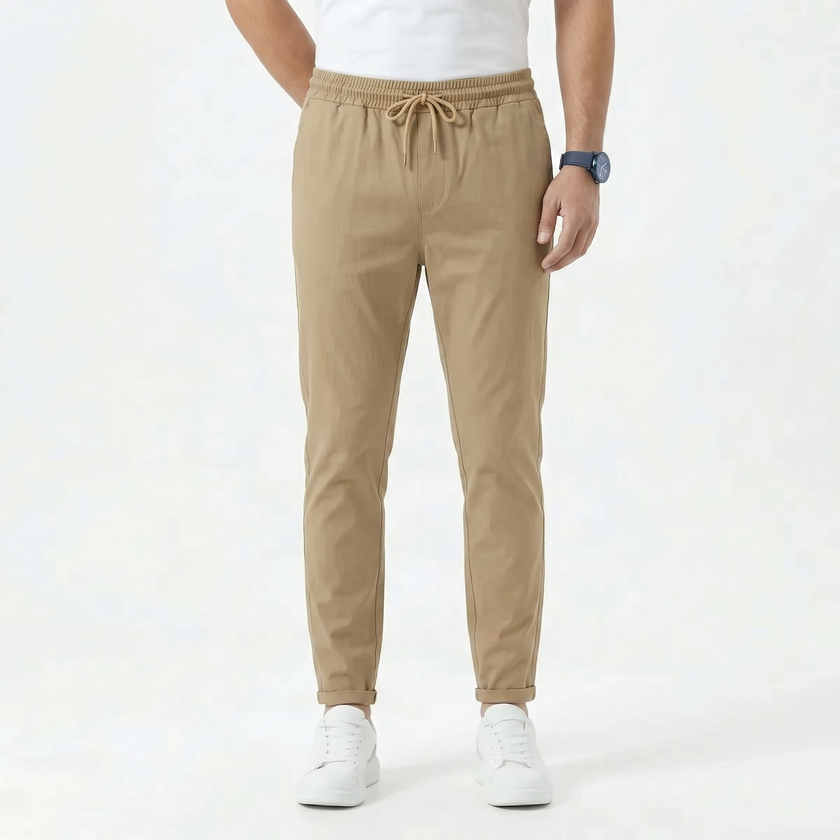 FJØRNA men's stretchable comfort trousers, casual men's pants with flexible fabric, shown in a relaxed fit on a model.