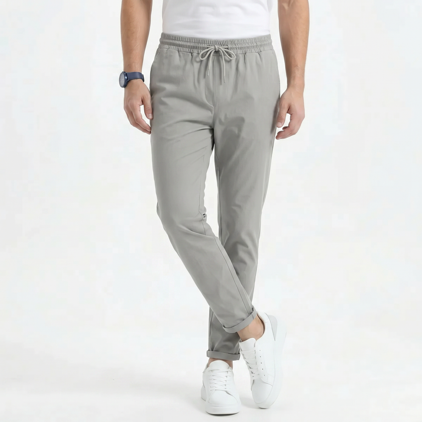 Men's stretchable comfort trousers by FJØRNA, casual men's pants with flexible fabric and a modern fit, shown in a neutral color.