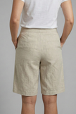 FJØRNA women's high-waisted summer shorts with knee length, drawstring waist, and side pockets, ideal for warm weather wear.