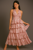 FJØRNA floral halter tiered ruffle maxi dress in old rose with waist detail and floral print, flowing and elegant for summer wear.