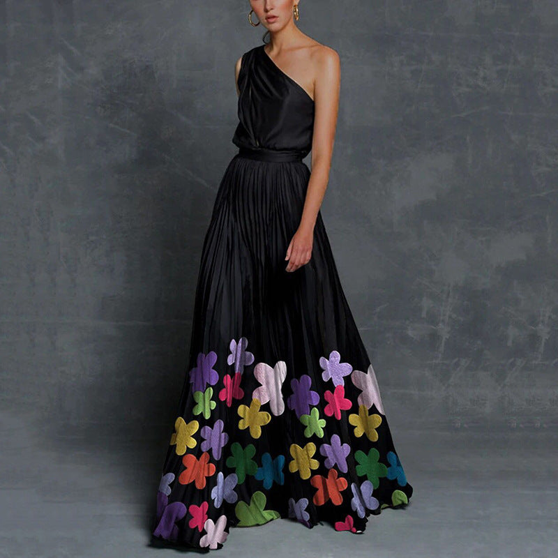 FJØRNA black floral one-shoulder casual wedding dress, perfect for beach and vacation days, with elegant floral pattern.