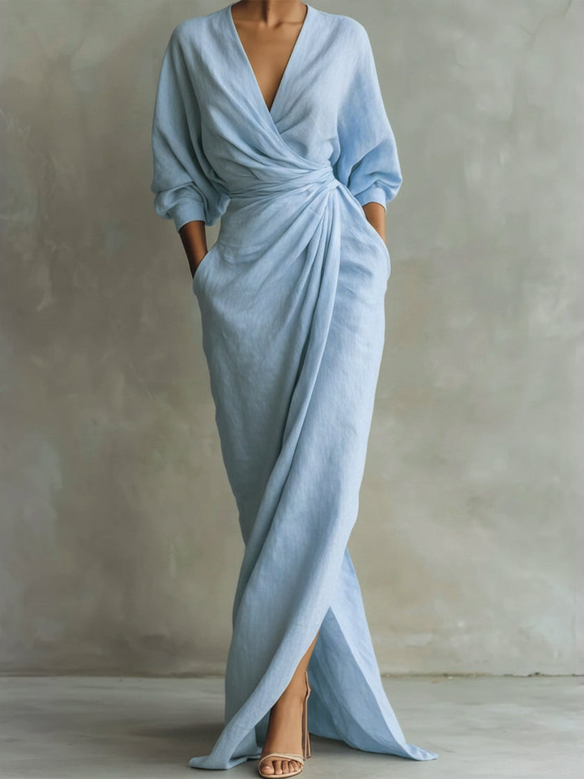 FJØRNA white V-neck wrap waist long sleeve maxi dress, elegant and flowing with a fitted bodice and full-length skirt.